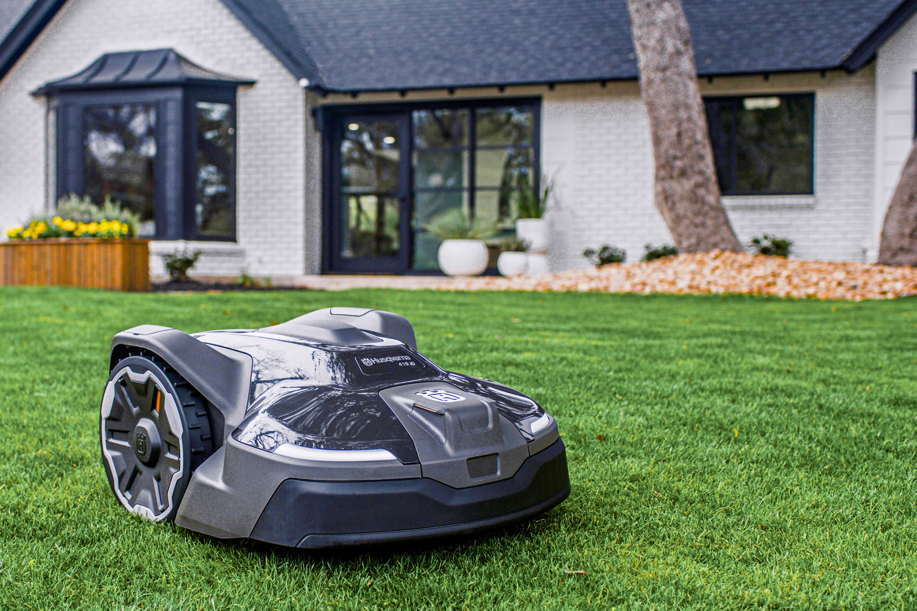 Robotic lawn mower on a residential front lawn